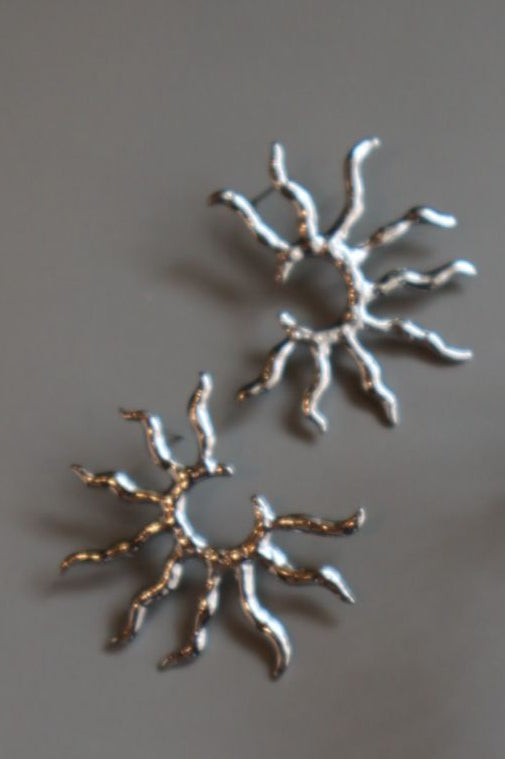 Aretes sol plateados